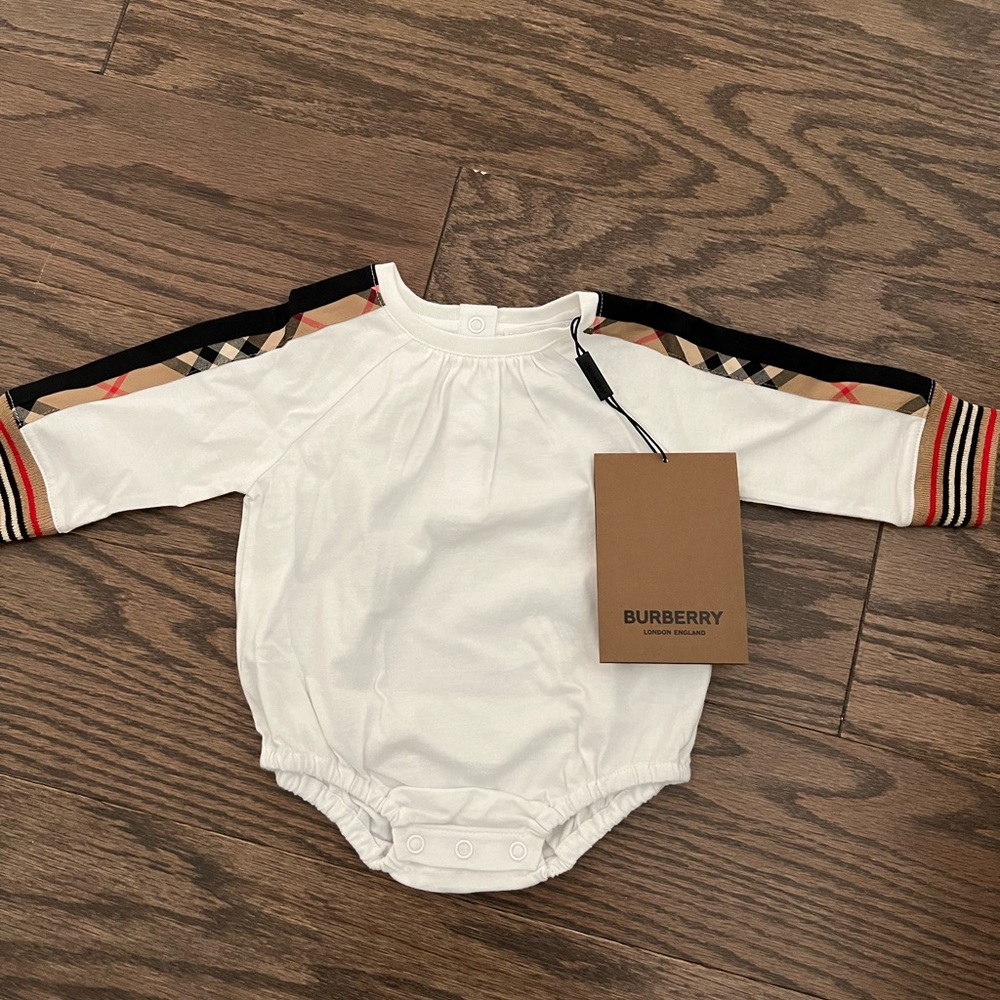 Brand new Burberry 3m onesie with tags. Never worn and kept in sealed condition